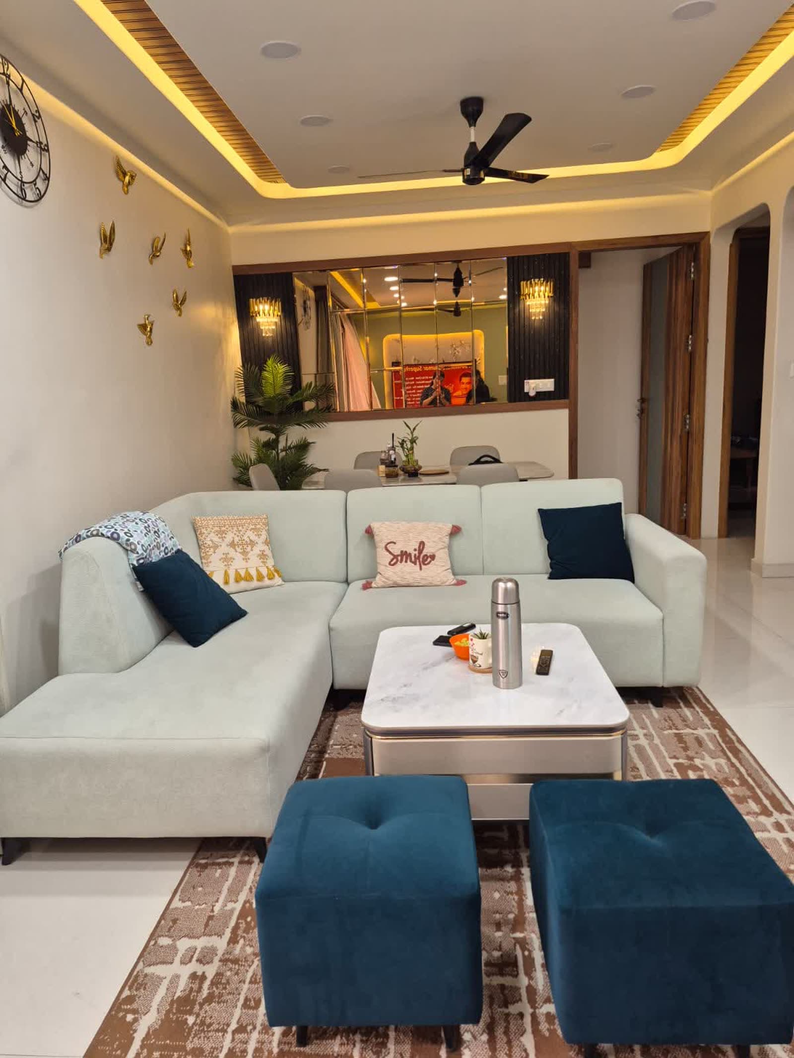 Finished cozy living room with sectional sofa and dining nook