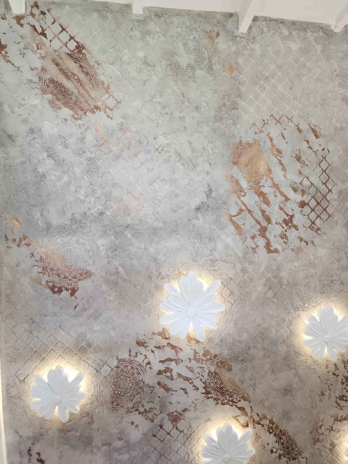 Mandala stencil texture wall with sculptural flower wall lights