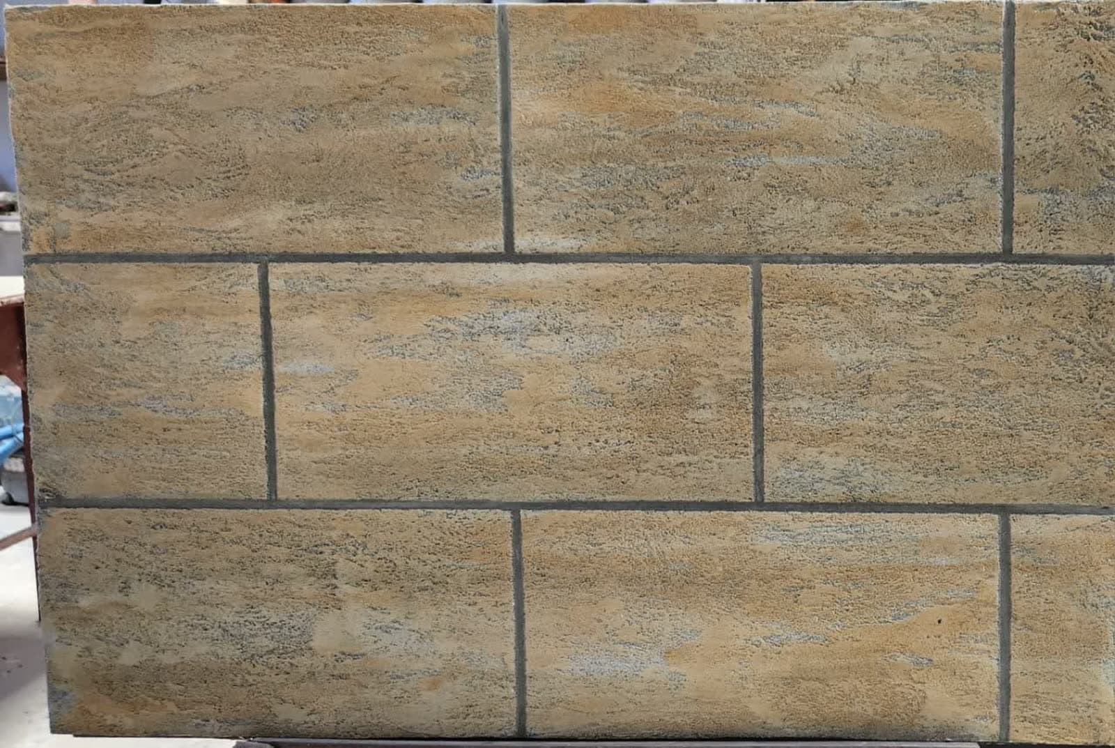 Hand-textured tan stone-effect wall tiles