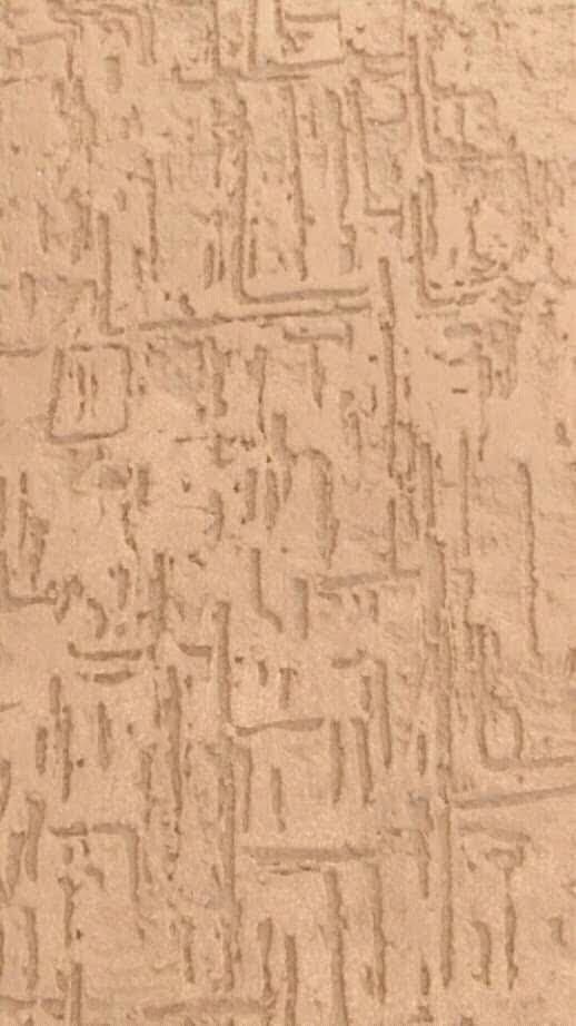 Close-up of a warm hand-applied plaster texture finish